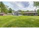 An exterior view of the house and backyard with a barn-style shed at 101 N Westbury Rd, Pendleton, IN 46064