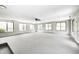 Finished basement features a ceiling fan, multiple windows, and new carpet at 101 N Westbury Rd, Pendleton, IN 46064