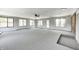 Expansive finished basement with a ceiling fan and multiple windows providing natural light at 101 N Westbury Rd, Pendleton, IN 46064