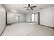 Large finished basement with a ceiling fan, new carpet, and a door to another room at 101 N Westbury Rd, Pendleton, IN 46064
