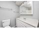 This bathroom features a tiled shower, white vanity, white walls, and a standard toilet at 101 N Westbury Rd, Pendleton, IN 46064