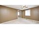 Bedroom with beige carpet, ceiling fan, and a closet with mirrored sliding doors at 101 N Westbury Rd, Pendleton, IN 46064