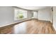 Inviting living room features hardwood floors and a large window at 101 N Westbury Rd, Pendleton, IN 46064