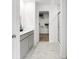 Modern bathroom with double sinks, quartz countertop, and a walk-in shower with a closet nearby at 1067 Marston Ln, Avon, IN 46123