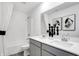 Bathroom with a double sink vanity, large mirror, black and white decor, and a shower with white curtain at 1067 Marston Ln, Avon, IN 46123