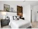 Beautiful bedroom with a decorative wood accent wall, and modern bedside tables with decorative lamps at 1067 Marston Ln, Avon, IN 46123