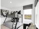Bedroom featuring a bunk bed with black and white patterned bedding, a black chair, and a window at 1067 Marston Ln, Avon, IN 46123