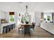 Modern dining area with stylish furniture and decor, connecting to the living area and kitchen at 1067 Marston Ln, Avon, IN 46123