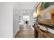 Hallway with stylish decor, wood-look floors and views of the dining room in the distance at 1067 Marston Ln, Avon, IN 46123