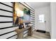 Stylish entryway featuring wood-look floors, decorative console table, and elegant artwork at 1067 Marston Ln, Avon, IN 46123