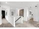 Upstairs hallway showcasing the neutral decor and bright, open layout at 1067 Marston Ln, Avon, IN 46123