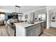Stylish kitchen island with stainless steel appliances and open view into the dining and living areas at 1067 Marston Ln, Avon, IN 46123