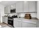 Kitchen featuring stainless appliances, gray cabinets and countertops at 1067 Marston Ln, Avon, IN 46123