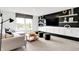 Modern living room with a sleek entertainment center, large window, and stylish seating at 1067 Marston Ln, Avon, IN 46123
