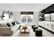 Modern living room with sleek built-ins, decor, and a large window at 1067 Marston Ln, Avon, IN 46123