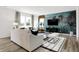 Bright and inviting living room featuring contemporary furnishings, stylish decor, and large windows at 1067 Marston Ln, Avon, IN 46123