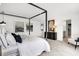 Light main bedroom with a four-poster bed, decor, and views into the en suite at 1067 Marston Ln, Avon, IN 46123