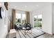 Cozy sitting area with comfortable chairs, modern decor, large windows, and view of the outdoors at 1067 Marston Ln, Avon, IN 46123
