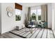 Inviting sitting area features comfortable chairs, stylish decor, natural light, and a modern rug at 1067 Marston Ln, Avon, IN 46123