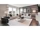 Bright living room featuring neutral tones, two sofas, two large windows, and modern decor throughout at 1075 Marston Ln, Avon, IN 46123