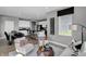 Stylishly decorated living room with a dining area and modern kitchen in the background at 1127 Marston Ln, Avon, IN 46123