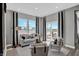 Open living room features contemporary decor, large windows, and seamless indoor-outdoor flow at 1127 Marston Ln, Avon, IN 46123