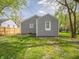 Wide backyard with a new fence and lush green grass, offering privacy and space for outdoor activities at 1132 Sharon Ave, Indianapolis, IN 46222