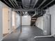 Unfinished basement with water heater and stairs at 1132 Sharon Ave, Indianapolis, IN 46222