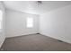 Bright bedroom with neutral carpet, white walls, and natural light at 1132 Sharon Ave, Indianapolis, IN 46222