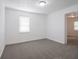 Bedroom with neutral walls, carpeted floors and a window with window blinds at 1132 Sharon Ave, Indianapolis, IN 46222