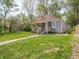 Angle view of home with manicured lawn and tidy landscaping at 1132 Sharon Ave, Indianapolis, IN 46222
