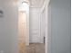 Hallway with multiple doorways and neutral walls, offering access to various rooms at 1132 Sharon Ave, Indianapolis, IN 46222