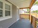 View from covered porch showing the wood railing and exterior siding at 1132 Sharon Ave, Indianapolis, IN 46222