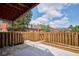 Private backyard with wooden fence, gravel, concrete patio, and small garden bed at 1142 Canterbury S Sq # B, Indianapolis, IN 46260