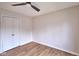 Bedroom featuring a modern ceiling fan, light walls, and double door closet at 1142 Canterbury S Sq # B, Indianapolis, IN 46260