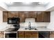 This newly remodeled kitchen includes modern appliances, light counters, and attractive cabinets at 1142 Canterbury S Sq # B, Indianapolis, IN 46260