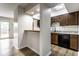 An open concept kitchen and dinning area with stainless steel appliances and lots of natural light at 1142 Canterbury S Sq # B, Indianapolis, IN 46260