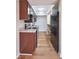 This kitchen has wood cabinets, stainless steel appliances, and light colored countertops at 1142 Canterbury S Sq # B, Indianapolis, IN 46260