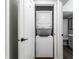 Laundry area featuring a stackable washer and dryer combo and light walls at 1142 Canterbury S Sq # B, Indianapolis, IN 46260
