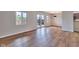 Bright living room with hardwood floors, windows and sliding doors leading to backyard at 1142 Canterbury S Sq # B, Indianapolis, IN 46260