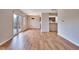 Open concept living room with French doors leading to a patio and a passthrough to the kitchen at 1142 Canterbury S Sq # B, Indianapolis, IN 46260