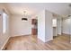 An open-concept floor plan with wood floors, dinning area, and lots of light from a window at 1142 Canterbury S Sq # B, Indianapolis, IN 46260
