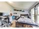 This is a bedroom featuring a bed, a desk with a computer and shelving at 115 S Center St, Maxwell, IN 46154