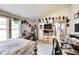 This is a bedroom featuring a full-sized bed, a desk, a dresser and multiple hats on display at 115 S Center St, Maxwell, IN 46154