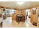Charming dining area with an open layout to the kitchen, wood accents, and lots of natural light at 115 S Center St, Maxwell, IN 46154