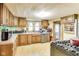Well-equipped kitchen featuring wooden cabinets, modern appliances, and abundant counter space at 115 S Center St, Maxwell, IN 46154