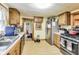 Functional kitchen with modern appliances, ample counter space, and wood cabinets for storage at 115 S Center St, Maxwell, IN 46154