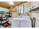 Laundry room featuring a side-by-side washer and dryer with storage shelving at 115 S Center St, Maxwell, IN 46154