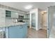 Stylish kitchen with blue cabinets, stainless steel appliances, and a spacious island with granite countertop at 11614 Buttonwood Dr, Carmel, IN 46033