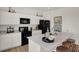Modern kitchen showcasing white cabinetry, stainless steel appliances, and a large island with seating at 11929 Vale St, Indianapolis, IN 46235